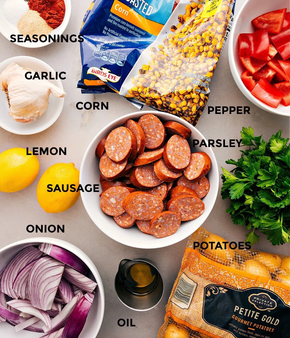 This recipe has everything prepped for straightforward assembly: meat, veggies, lemon, seasonings, and oil.