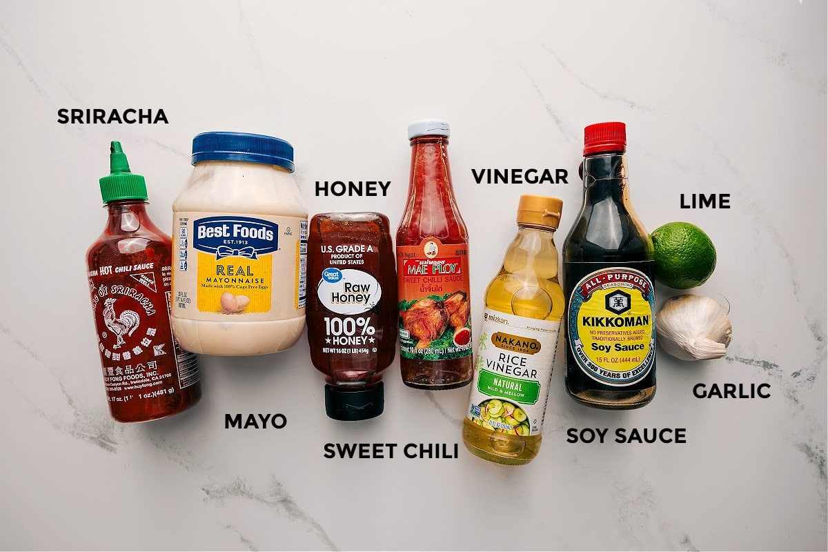 All the dressing ingredients for this soba noodle salad recipe prepped out for straightforward assembly including the sriracha, mayo, honey, sweet chili, vinegar, soy sauce, garlic, and lime.