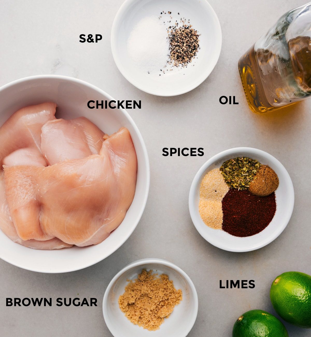Everything’s prepped and ready for straightforward assembly—chicken, spices, oil, limes, and brown sugar.