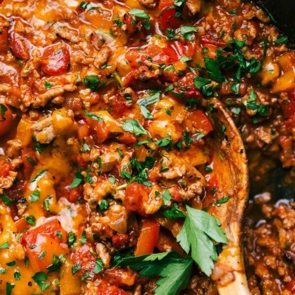 Unstuffed peppers, a pan full of satisfying savory ingredients, including meat and peppers, topped with fresh herbs.