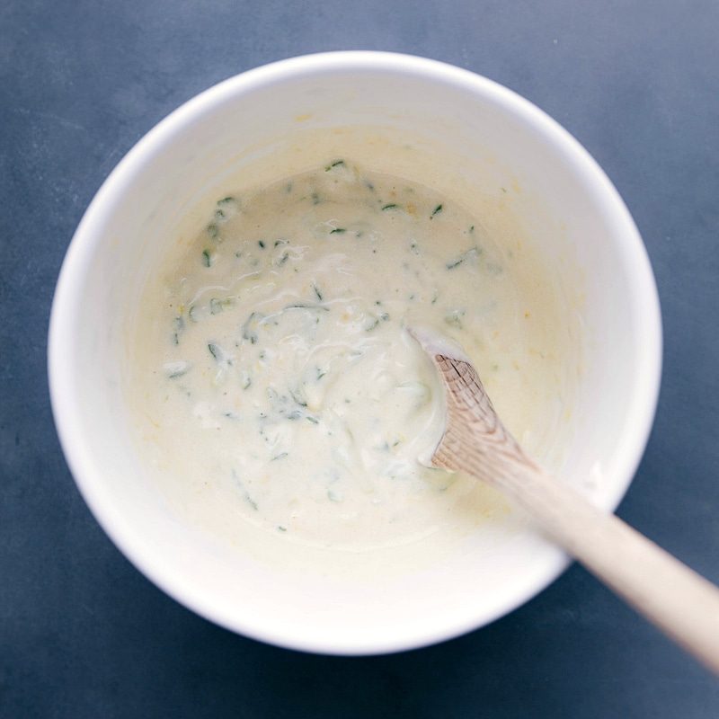 A bowl of satisfying and tangy tzatziki sauce, creamy and ready to accompany the recipe.
