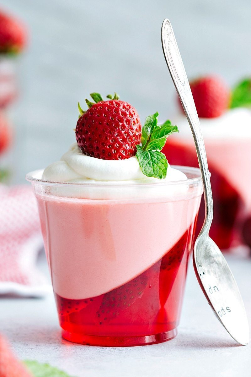 The coolest and EASIEST hack to make these slanted strawberry jell-o parfait cups with a strawberry mousse on top. satisfying and so straightforward!! Via flexfa.com