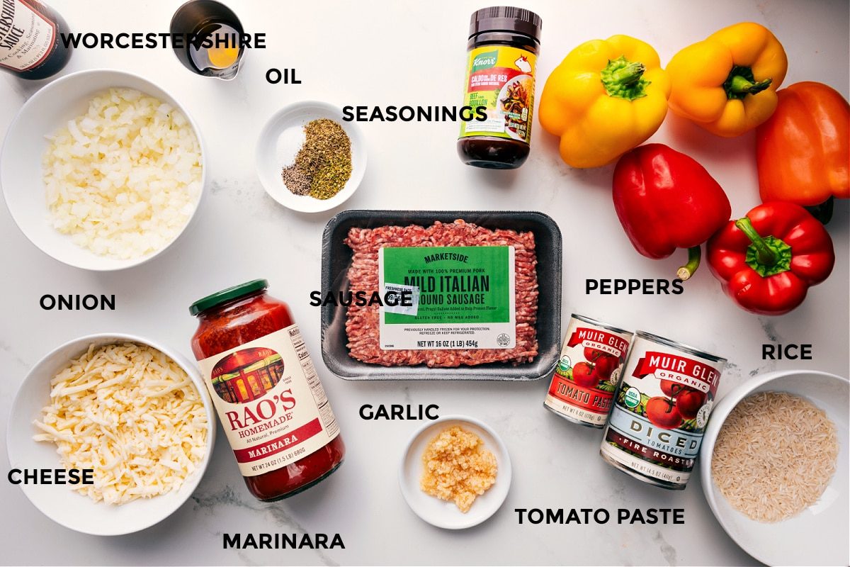 All the ingredients for Italian stuffed peppers prepped for straightforward assembly, including Worcestershire sauce, onion, cheese, marinara, seasonings, garlic, tomato paste, rice, and peppers.