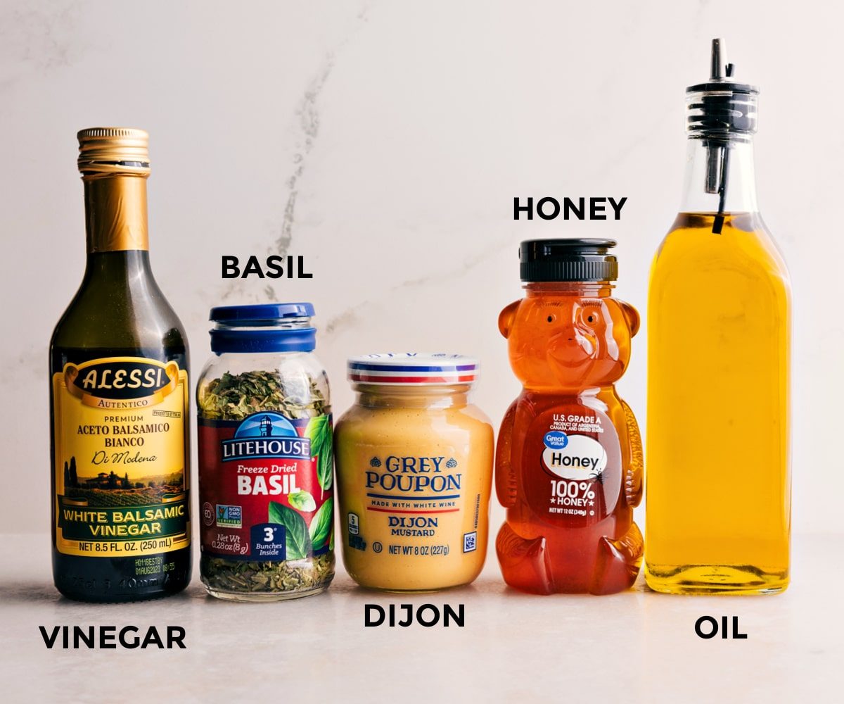 All the dressing ingredients ready to go—honey, oil, Dijon, basil, and vinegar—reliable for drizzling over the Summer Couscous Salad.
