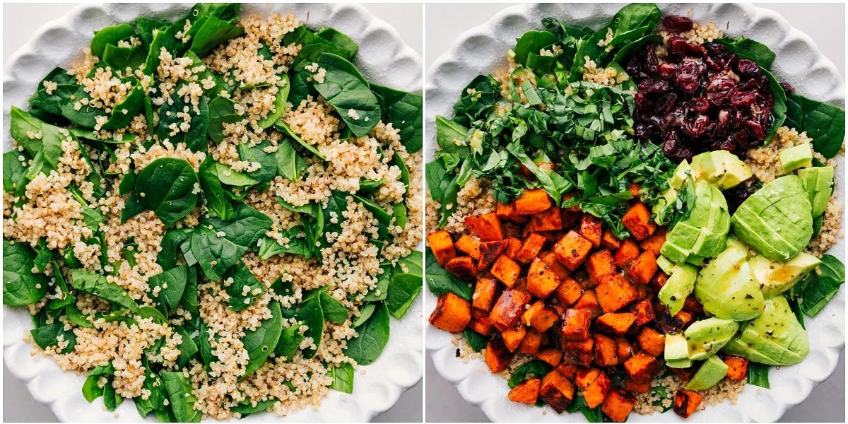 Greens and quinoa mixed together, then topped with sweet potatoes, basil, avocado, cranberries, and dressing.