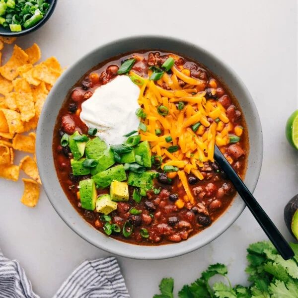 A bowl of Taco Soup with various toppings adds a burst of flavor and texture to this satisfying dish.