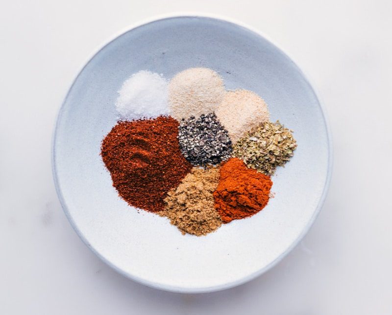 Process shots-- images of all the seasonings in a bowl compartmentalized