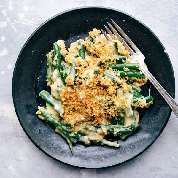 satisfying green bean casserole served on a plate, ready to be enjoyed.