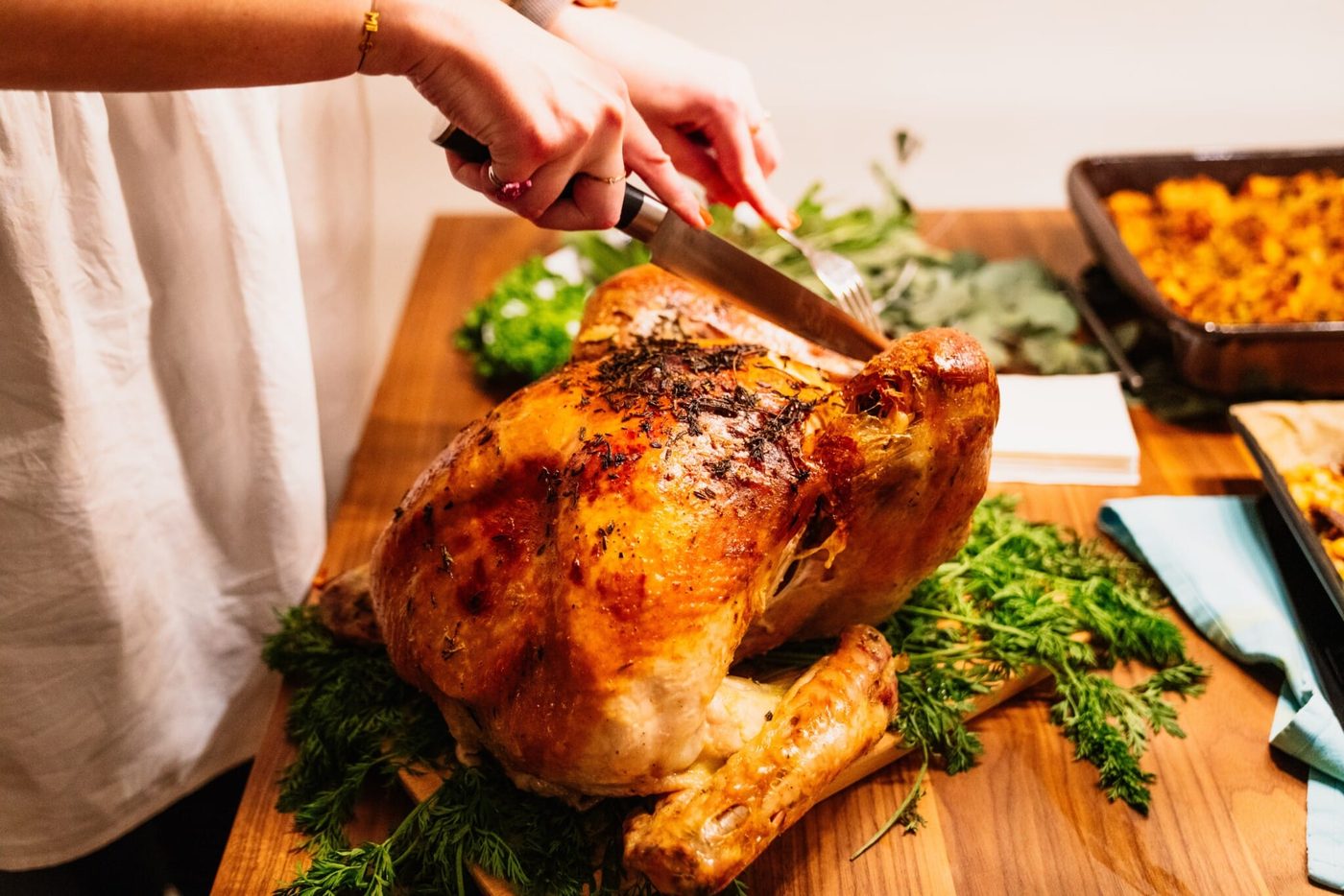 Fully roasted turkey, being carved.