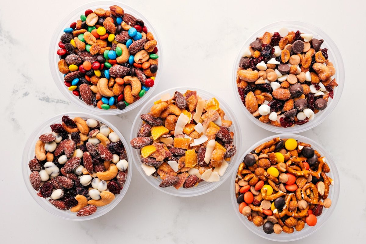 5 different variations of these snack mixes set out to enjoy.