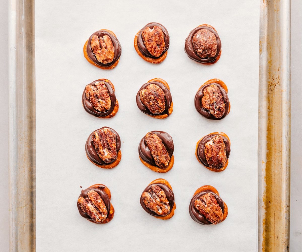 Fresh out of the oven, with pecans pressed right on top for these Rolo Pretzel Turtles.