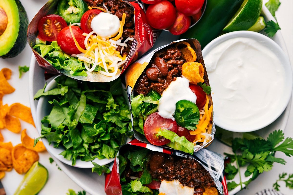 Walking tacos filled with all the toppings, ready to be served and enjoyed for a mess free dinner.