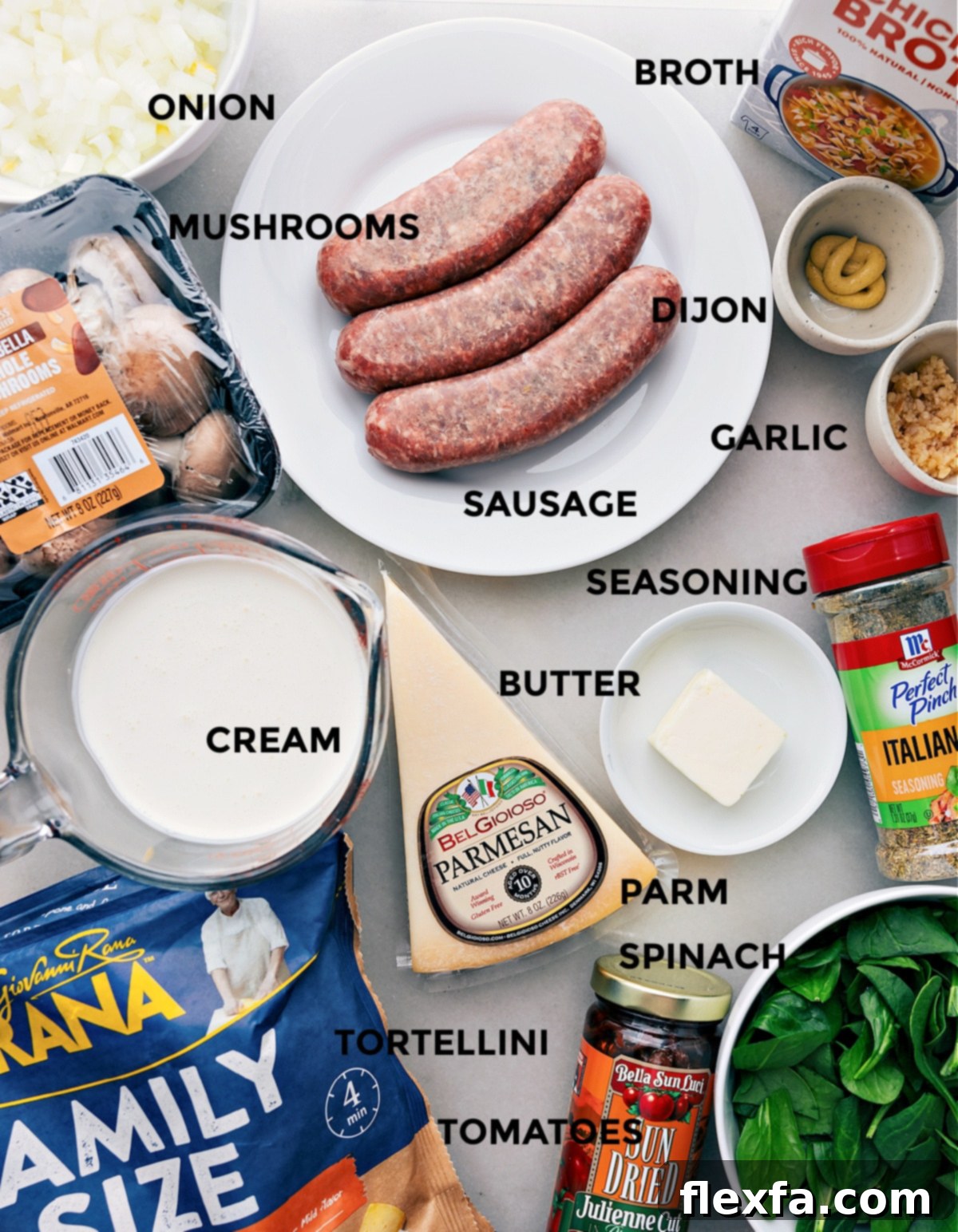 All the fresh ingredients for Sausage Tortellini Bake prepped and ready for easy assembly on a wooden board.