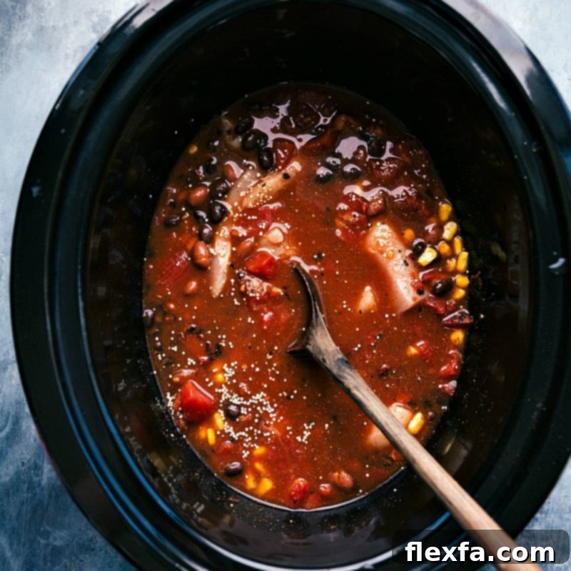 All ingredients mixed together in the slow cooker, ready to be cooked.