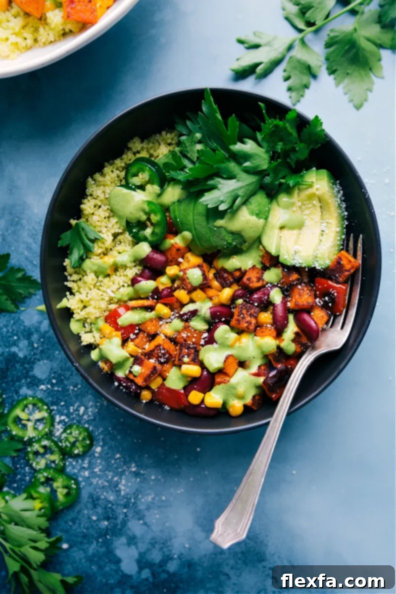 Delicious Meatless Kidney Bean Bowls with roasted sweet potatoes, bell peppers, kidney beans, couscous, avocado, and creamy lemon-herb cashew sauce