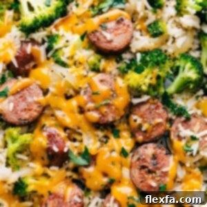 Close-up of Cheesy Chicken, Broccoli, and Rice on a sheet pan.