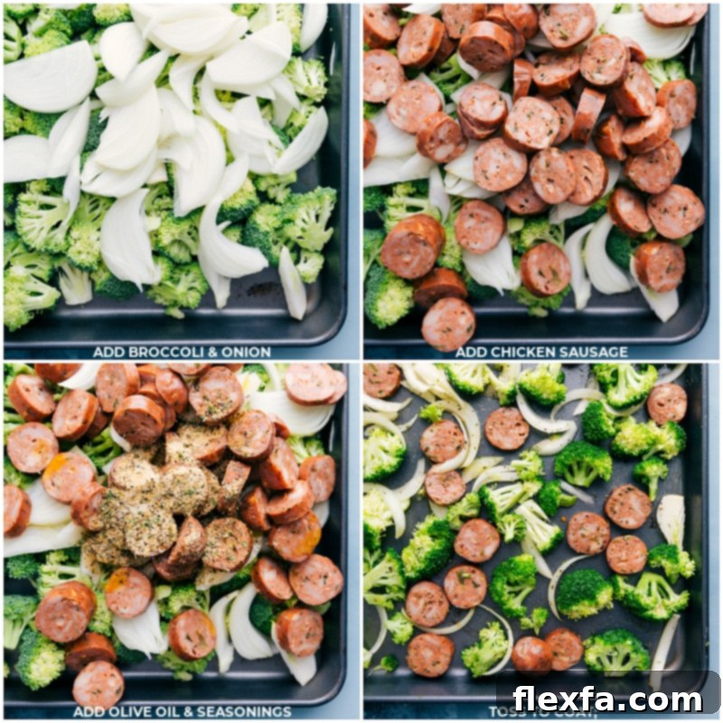 Broccoli, onions, and chicken sausage arranged on a sheet pan with olive oil and seasoning, ready for roasting.
