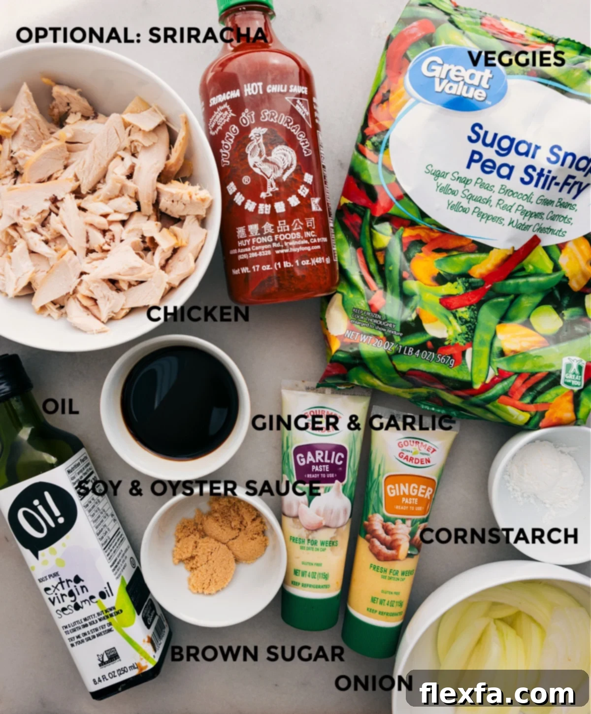 Ingredients In Rotisserie Chicken Stir Fry All the ingredients for the quick Rotisserie Chicken Stir-Fry recipe laid out: frozen mixed vegetables, pre-cooked chicken, soy sauce, oyster sauce, sesame oil, cornstarch, brown sugar, garlic, ginger, and sliced onion.