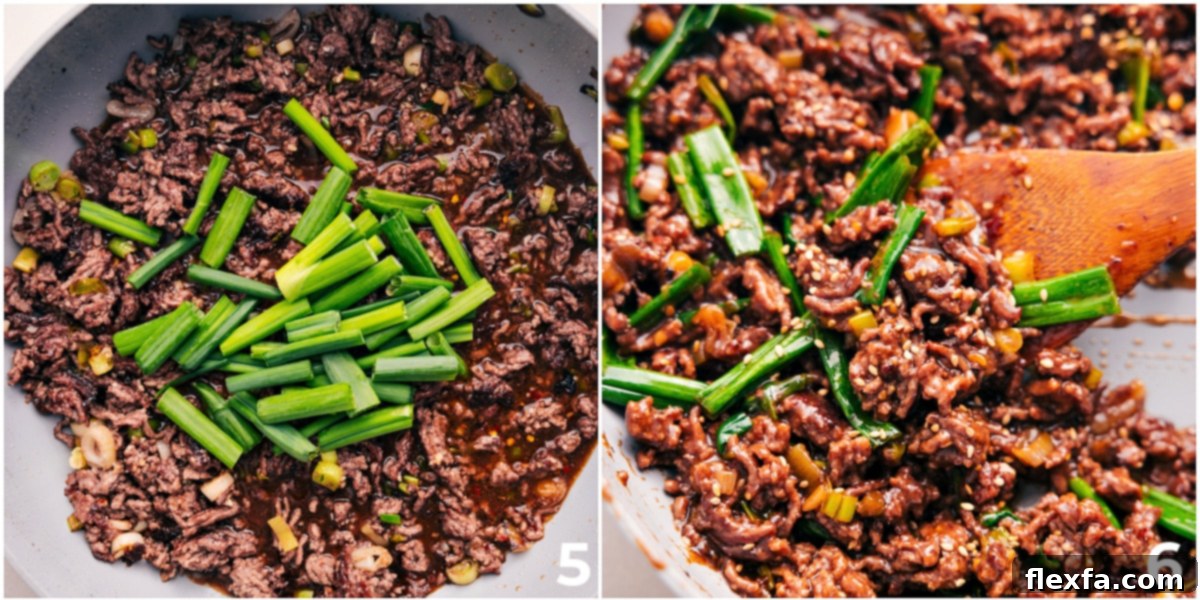 Mongolian Ground Beef Recipe with Fresh Toppings The finished Mongolian Ground Beef dish in a pot with fresh green onions being added.