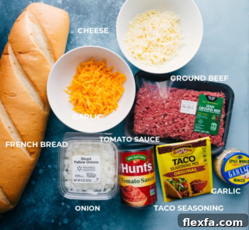 A vibrant display of all the fresh ingredients required to make French Bread Taco Pizza.