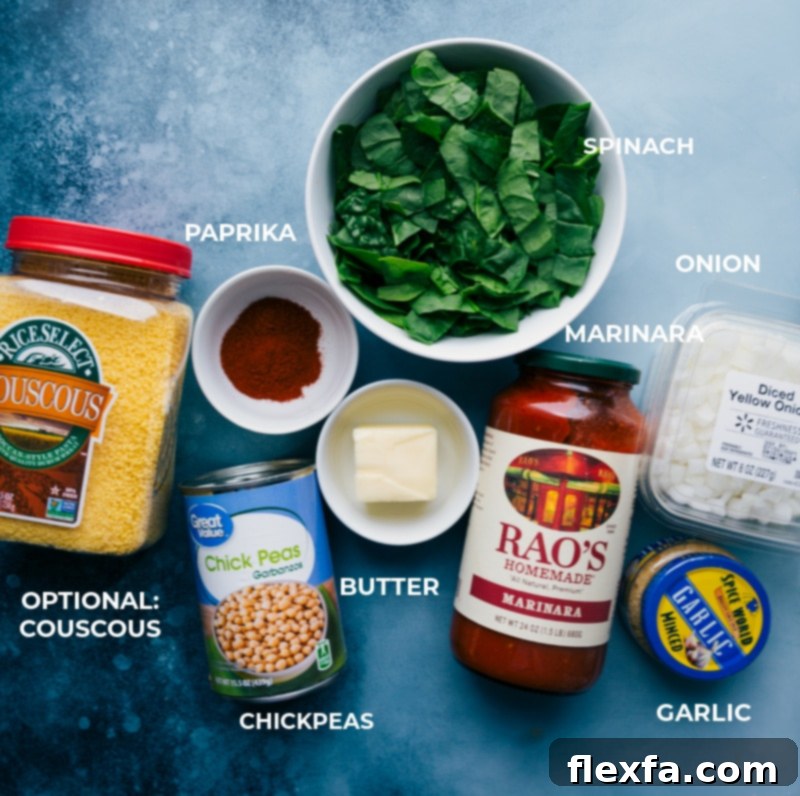Fresh ingredients laid out for the Chickpea Beans on Toast recipe, including chickpeas, baby spinach, marinara sauce, butter, diced onion, minced garlic, and paprika.