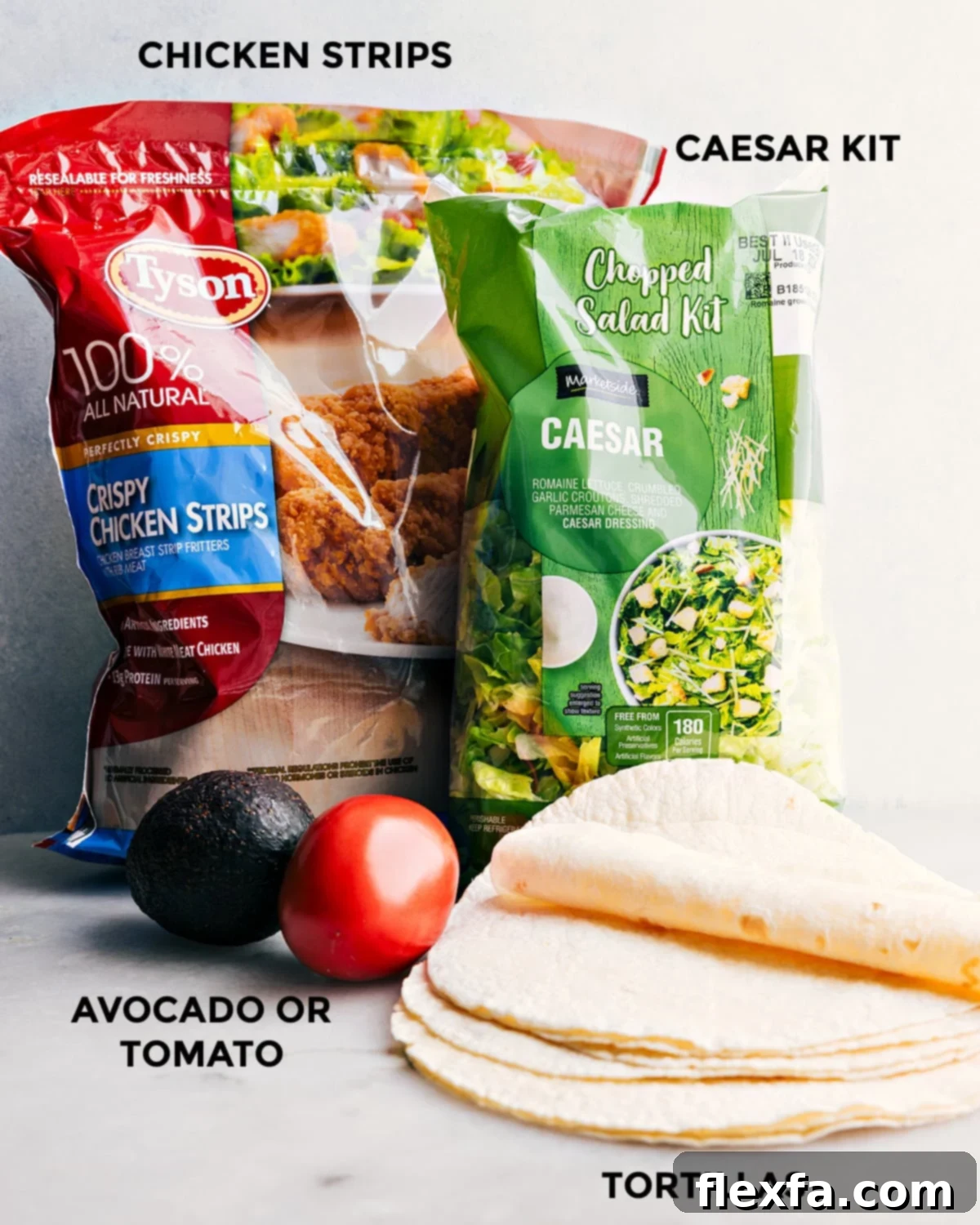 All the fresh ingredients for the Chicken Caesar Wrap recipe meticulously arranged on a clean counter, ready for assembly.