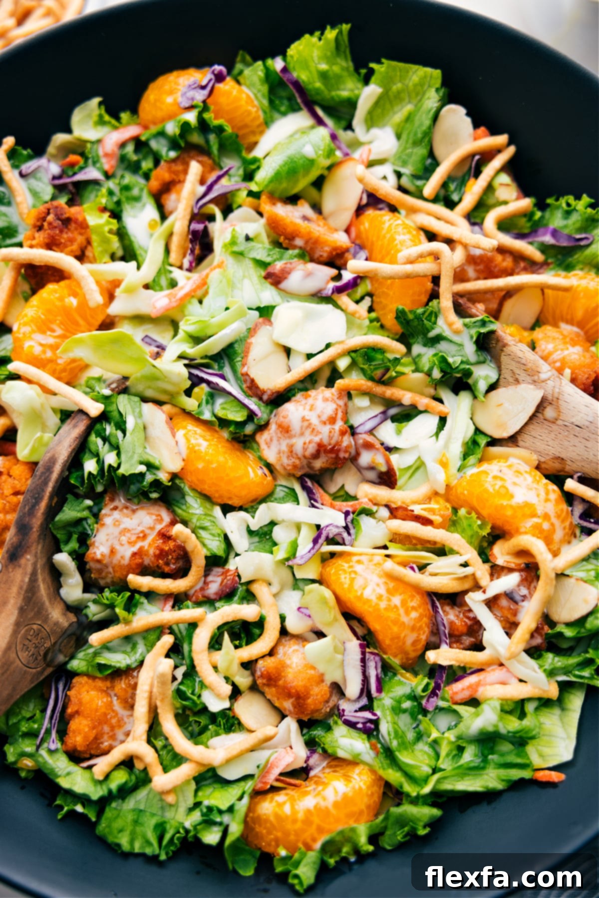 A close-up shot of the finished Applebee's Chicken Salad, beautifully presented in a bowl, highlighting its vibrant ingredients and inviting textures.
