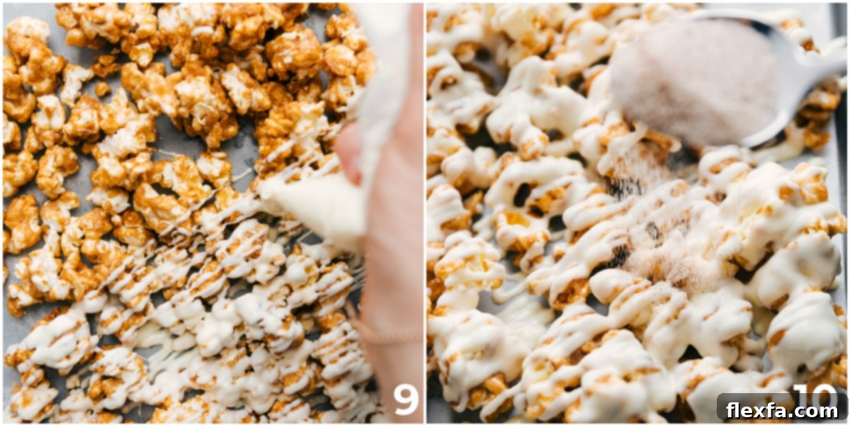 A close-up view of finished Cinnamon Roll Popcorn, glistening with white chocolate drizzle and a generous sprinkle of cinnamon sugar, ready to be enjoyed.