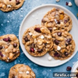 A perfectly baked Trail Mix Cookie, golden brown and packed with visible mix-ins.