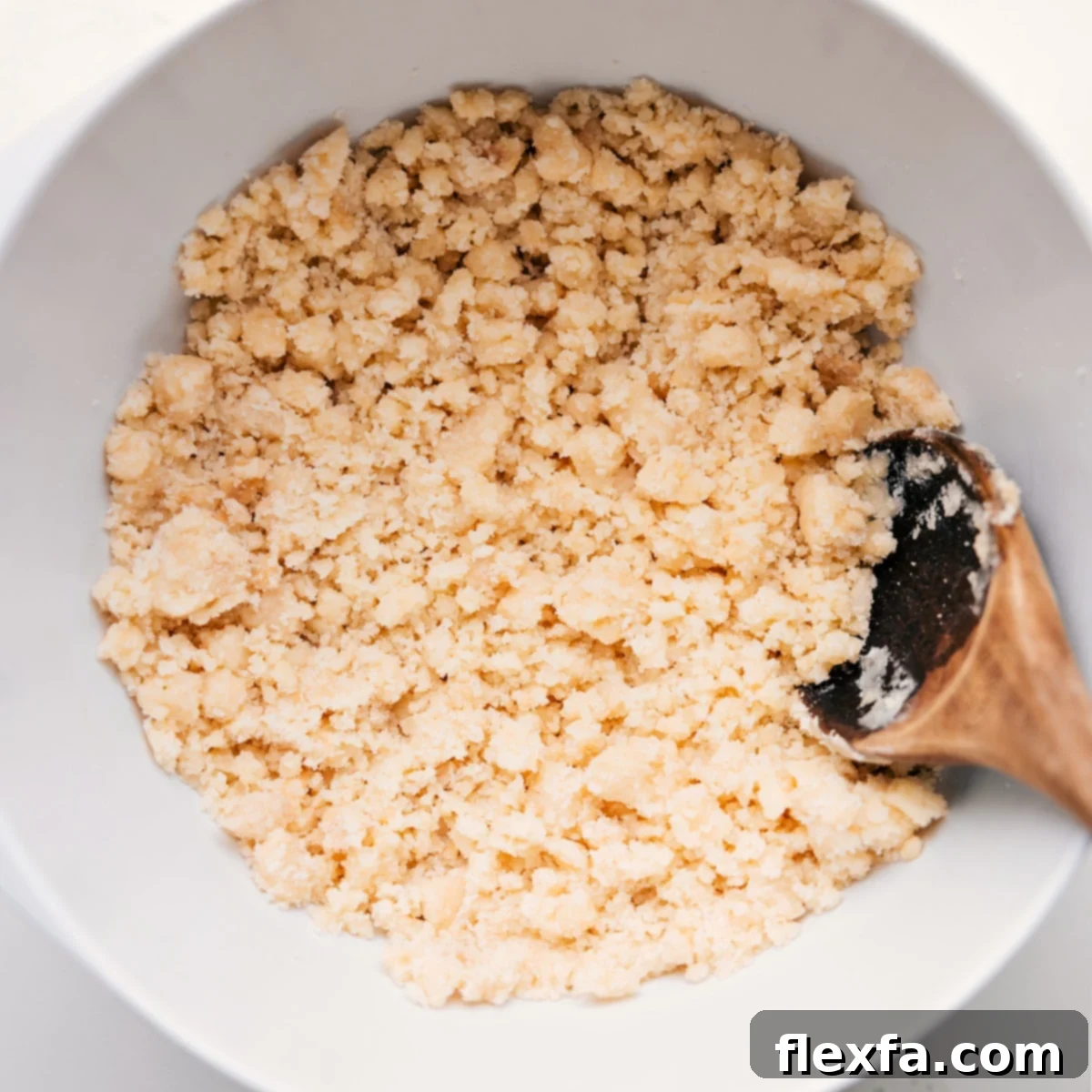 Close-up shot of the delicious, crumbly topping mix for the blueberry cobbler recipe, ready to be sprinkled over the fruit.
