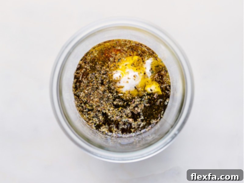 Process shots showing various ingredients being added into a jar to make Italian salad dressing
