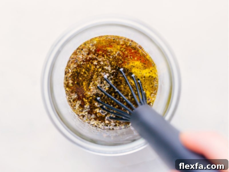 Process shots showing the Italian dressing ingredients being whisked together in a bowl