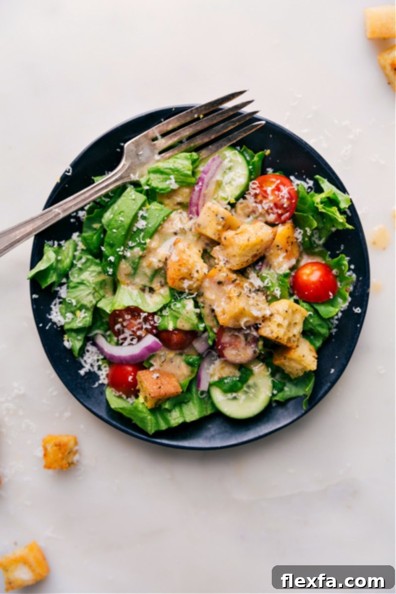 Overhead image of a large, fresh green salad generously topped with homemade Italian Dressing