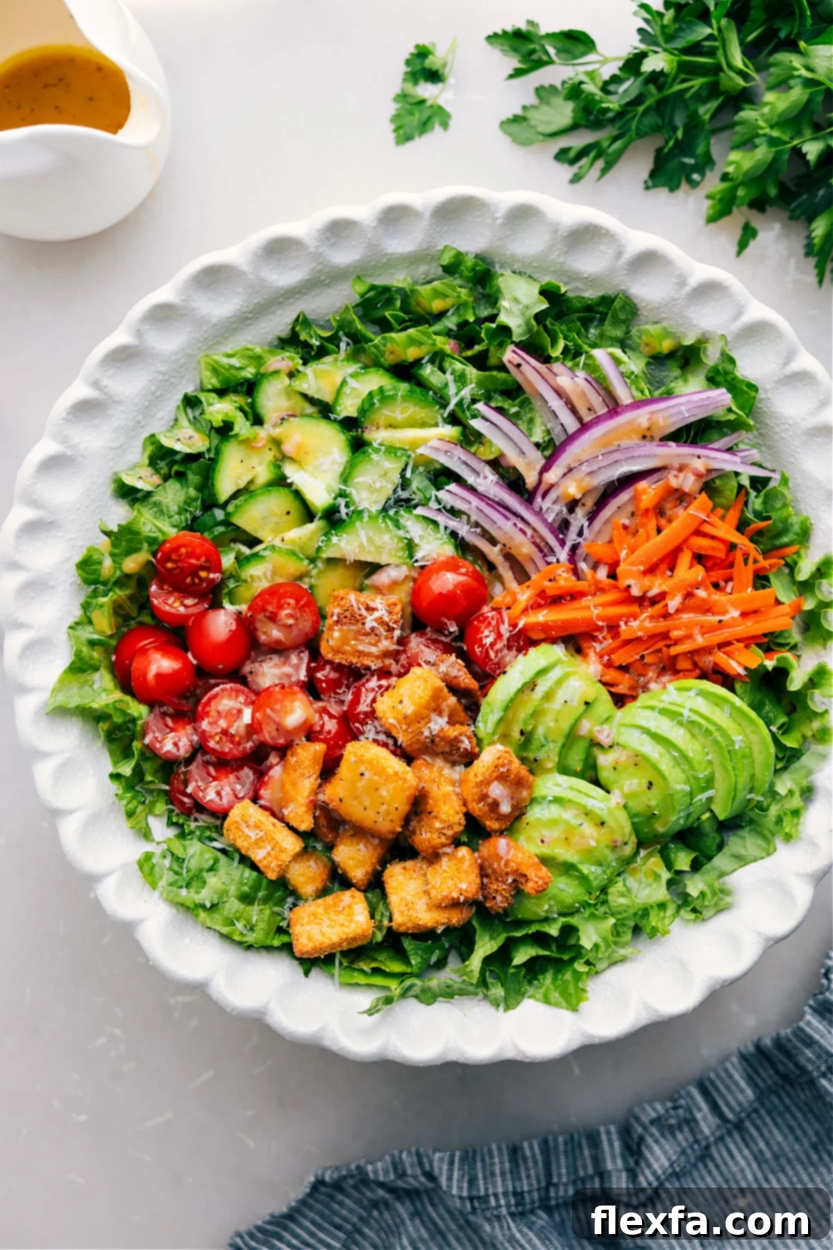 Delicious & Fresh Garden Salad in a Bowl Freshly prepared garden salad in a large wooden bowl, showcasing vibrant greens, red tomatoes, and other colorful vegetables, ready to be served.