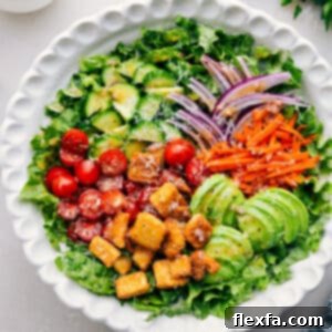 Close-up of a fresh garden salad with vivid green lettuce and colorful vegetables in a bowl, appealing and healthy.