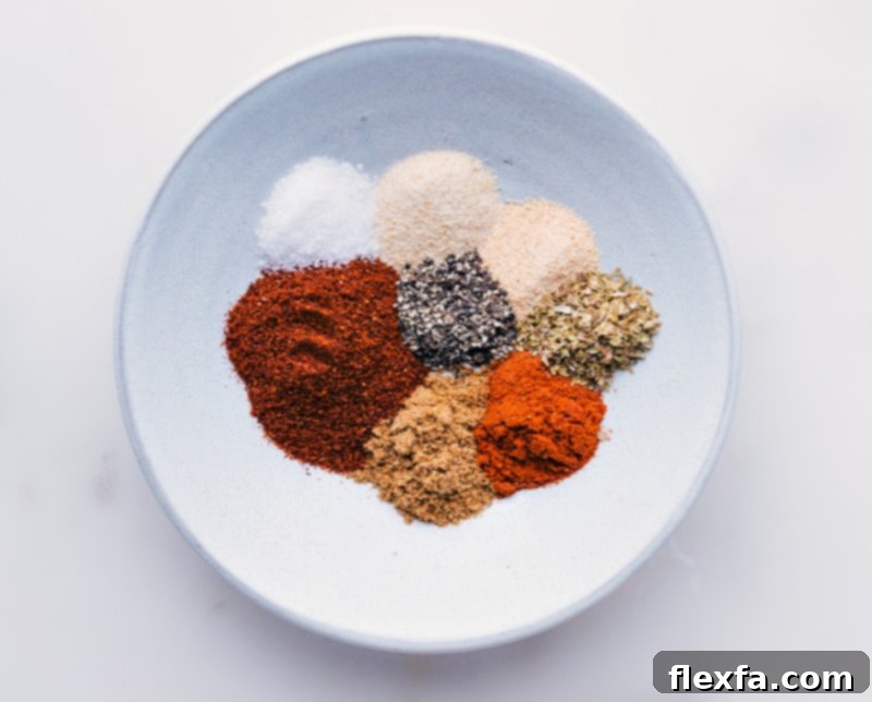 Process shots showing individual spices (chili powder, cumin, paprika, etc.) neatly arranged in a bowl before mixing, highlighting the fresh ingredients.