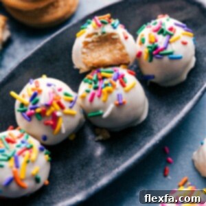 A close-up image of a perfectly dipped and decorated Golden Oreo Truffle, showcasing its delicious white chocolate coating.