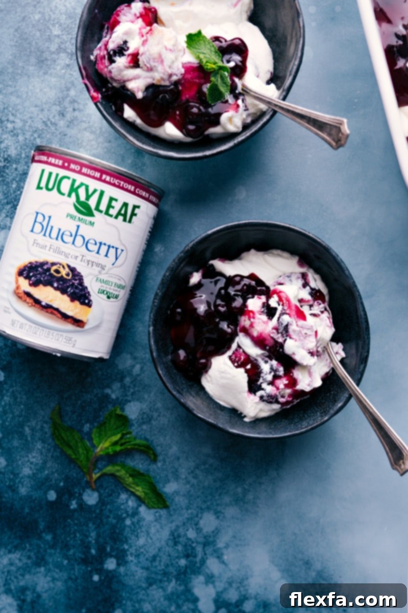 Overhead image of Blueberries and Cream Cake Trifle served in bowls.