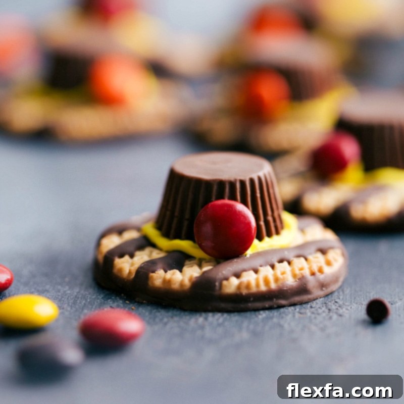 Creative pilgrim hats crafted from classic cookies, miniature chocolate, and colorful candy, a playful and easy addition to your Thanksgiving dessert menu.