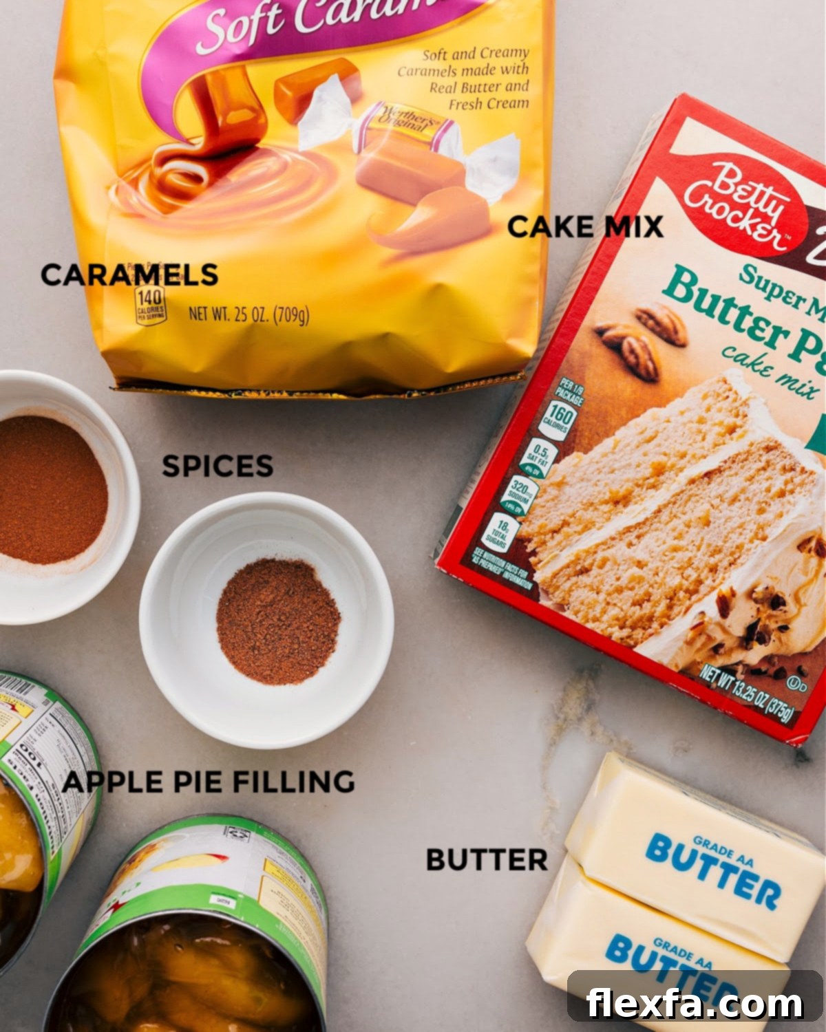 Apple Dump Cake Ingredients All the essential ingredients for Apple Dump Cake laid out: apple pie filling, ground cinnamon, yellow cake mix, unsalted butter, and optional caramels.