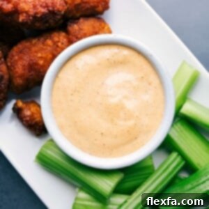 Chipotle Ranch Dip in a bowl with ingredients around it