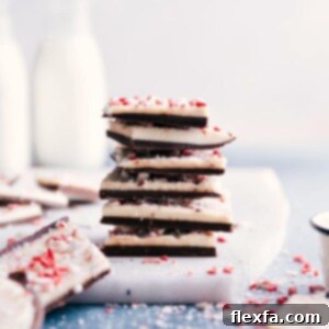 Finished Peppermint Bark pieces artfully arranged on a plate, ready for serving.