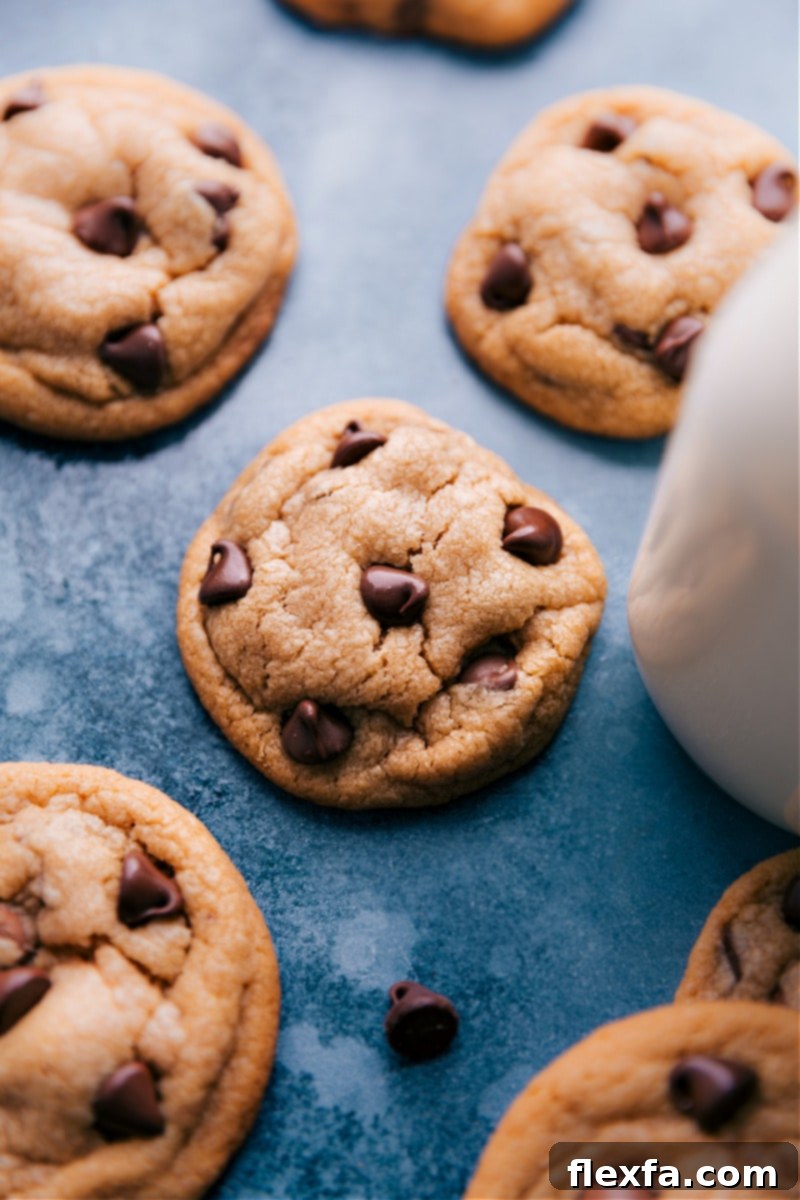 Stacked high, these Peanut Butter Chocolate Chip Cookies boast a perfect thick, soft center and irresistible chocolate. Image of the stacked Peanut Butter Chocolate Chip Cookies, showcasing their thick, soft, and appealing appearance