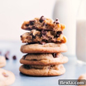 Peanut Butter Chocolate Chip Cookies stacked on a cooling rack