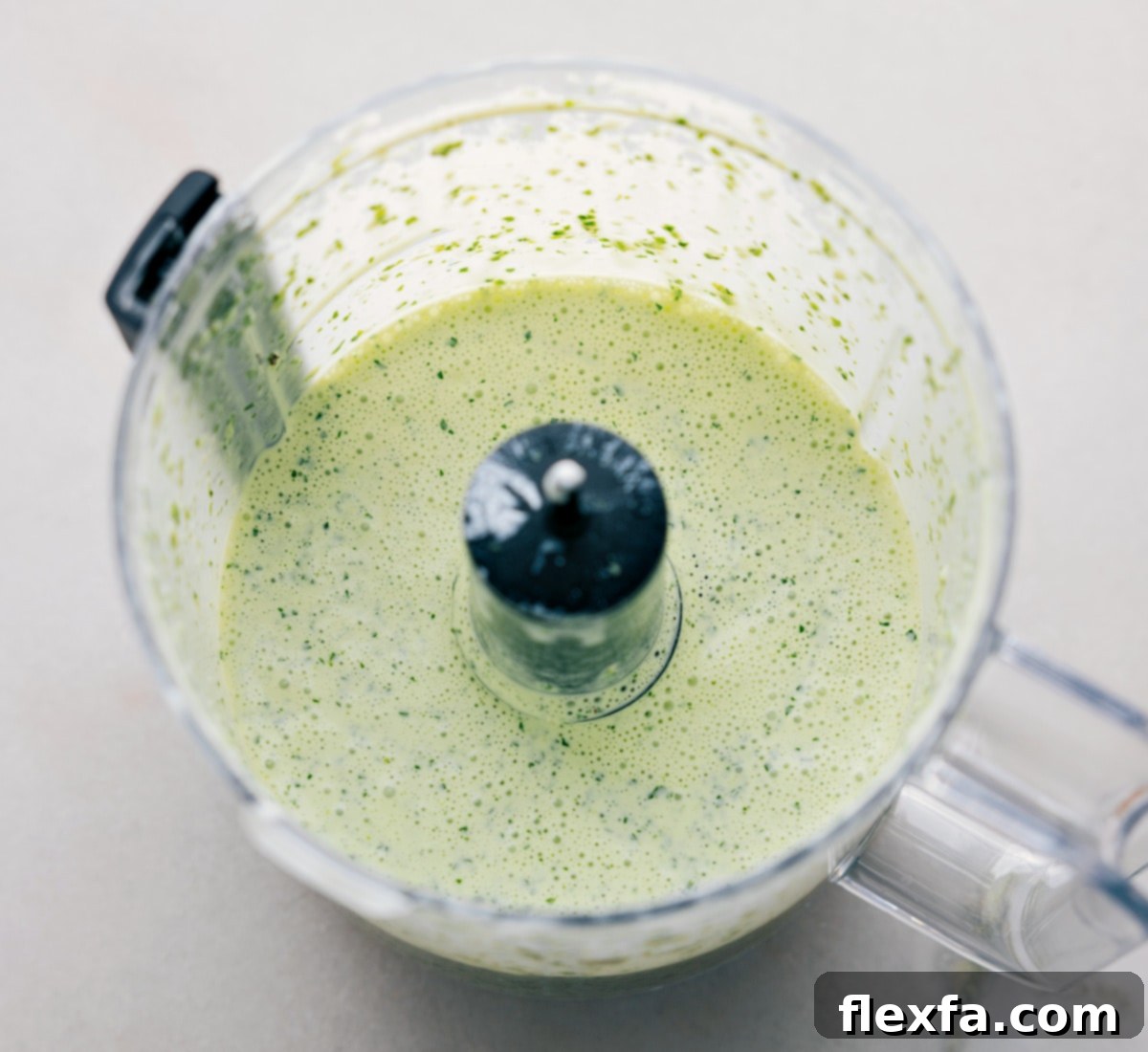 All the ingredients being pulsed together in a food processor.
