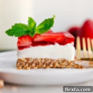 A beautifully presented slice of Strawberry Pretzel Salad, highlighting its layers.