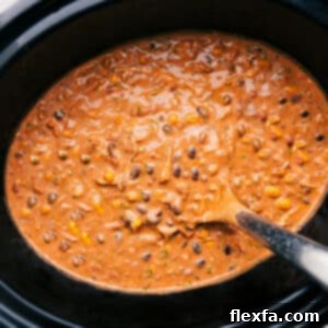 A delicious bowl of creamy chicken chili topped with fresh cilantro.