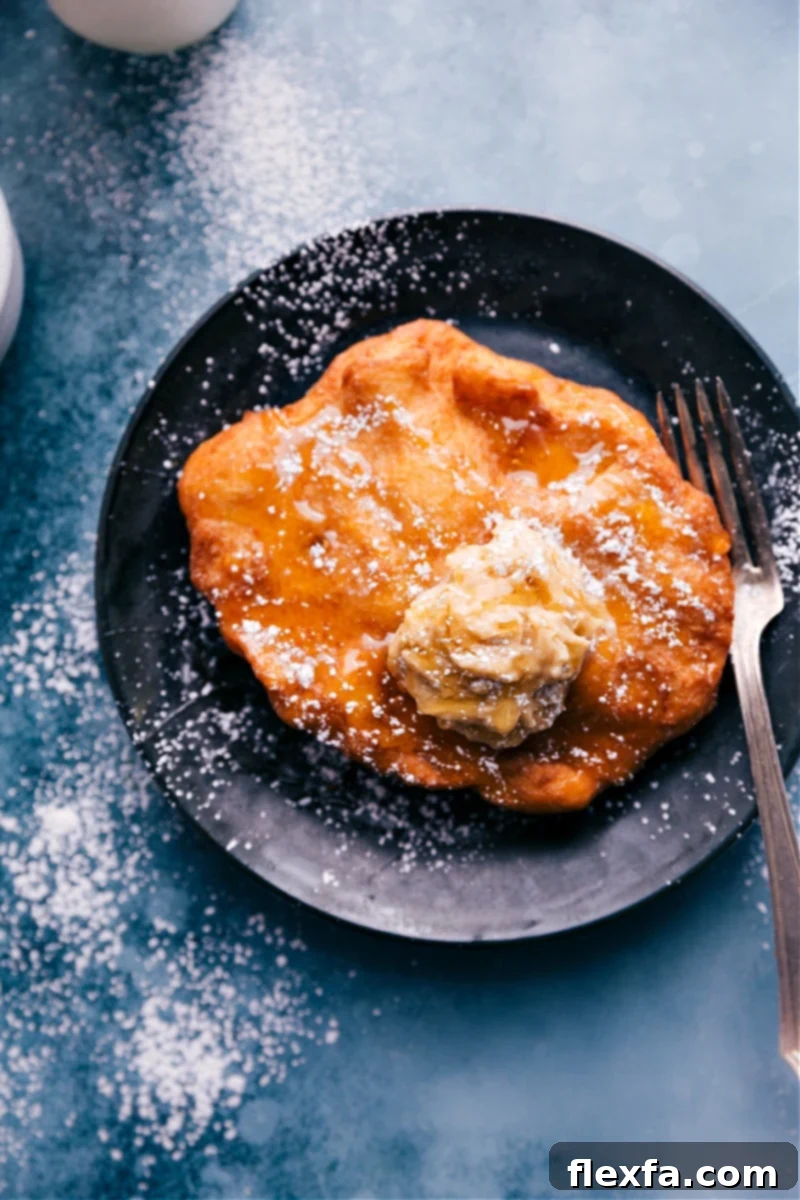 Overhead image of freshly fried Utah Scones ready to be served with toppings