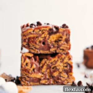 Campfire Delight Cereal Bars 3 A close-up of a stack of S'mores Cereal Bars, highlighting their soft, chewy, and chocolatey layers.