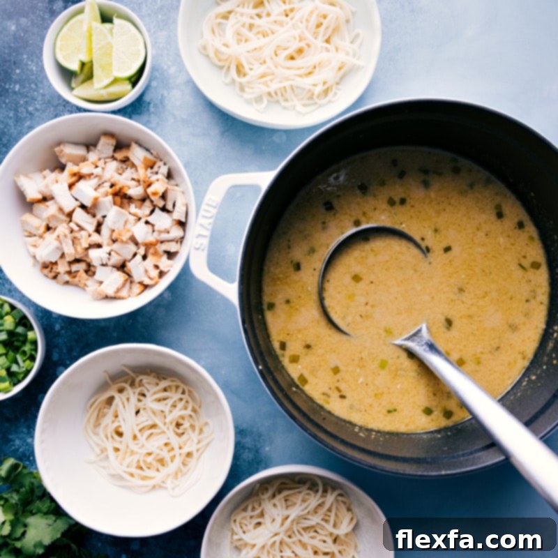 Ingredient shots of Green Curry Noodle Soup showing bowls being prepped for serving